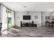 Spacious living room featuring hardwood floors and a view to the dining area at 12791 W Caraveo Pl, Peoria, AZ 85383