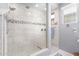 Walk-in shower with tile surround and bench at 12791 W Caraveo Pl, Peoria, AZ 85383