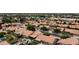 Real estate aerial view showing well-manicured lawns, private pools, and mature trees at 1450 W Sea Haze Dr, Gilbert, AZ 85233