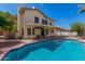 Inviting backyard with a private swimming pool, covered patio and lush landscaping at 1450 W Sea Haze Dr, Gilbert, AZ 85233