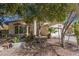 Front yard features desert landscaping, mature trees, and a single car garage at 1450 W Sea Haze Dr, Gilbert, AZ 85233