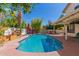 Backyard pool and shaded patio area offer an ideal space for outdoor enjoyment at 1450 W Sea Haze Dr, Gilbert, AZ 85233