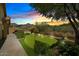 Putting green with mountain views at sunset at 15165 N 102Nd Way, Scottsdale, AZ 85255