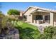 Covered patio, putting green, and fire pit at 15165 N 102Nd Way, Scottsdale, AZ 85255