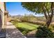 Landscaped backyard with putting green and mountain views at 15165 N 102Nd Way, Scottsdale, AZ 85255