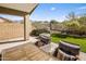 Relaxing backyard oasis with seating area, fire pit, and mountain views at 15165 N 102Nd Way, Scottsdale, AZ 85255