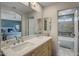 Bathroom with double vanity, large mirror, and separate tub and shower at 15165 N 102Nd Way, Scottsdale, AZ 85255