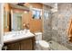 Small bathroom with patterned tile shower and single vanity at 15165 N 102Nd Way, Scottsdale, AZ 85255