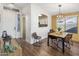 Dining area with wood floors and access to kitchen at 15165 N 102Nd Way, Scottsdale, AZ 85255