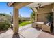 Covered patio with seating area and putting green view at 15165 N 102Nd Way, Scottsdale, AZ 85255