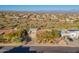 Wide aerial view of a neighborhood showcasing desert landscaping and mountain views at 15838 E Thistle Dr, Fountain Hills, AZ 85268