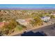 Expansive aerial view of a neighborhood with desert landscape and houses with red tile roofs at 15838 E Thistle Dr, Fountain Hills, AZ 85268