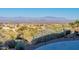 Scenic backyard view with desert landscape, neighborhood homes, and mountains in the distance at 15838 E Thistle Dr, Fountain Hills, AZ 85268