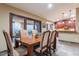 Dining area with large windows offering scenic views and adjacent kitchen space at 15838 E Thistle Dr, Fountain Hills, AZ 85268