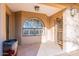 Attractive front entryway featuring a decorative screen door and arched window at 15838 E Thistle Dr, Fountain Hills, AZ 85268