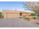 Charming single-story home featuring desert landscaping and a two-car garage at 15838 E Thistle Dr, Fountain Hills, AZ 85268