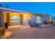 Inviting front patio with comfortable seating and arched windows, perfect for relaxing evenings at 15838 E Thistle Dr, Fountain Hills, AZ 85268