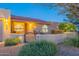 Attractive single-story home with gated front patio, desert landscaping, arched windows, and a red tile roof at 15838 E Thistle Dr, Fountain Hills, AZ 85268