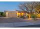 Charming single-story home featuring a brick driveway, two-car garage, desert landscaping, and a red tile roof at 15838 E Thistle Dr, Fountain Hills, AZ 85268