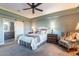 Main bedroom with decorative ceiling and a peek into the adjacent en suite bath at 15838 E Thistle Dr, Fountain Hills, AZ 85268