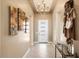 Bright and spacious entryway with high ceilings and elegant chandelier at 15957 E Ridgestone Dr, Fountain Hills, AZ 85268