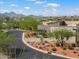 View of home's exterior showcasing stone accents and landscaping at 15957 E Ridgestone Dr, Fountain Hills, AZ 85268