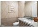 Stylish powder room with unique wallpaper and granite vanity at 15957 E Ridgestone Dr, Fountain Hills, AZ 85268