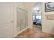 Bathroom with a shower and view into bedroom at 15973 W Sheila Ln, Goodyear, AZ 85395