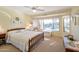 Bedroom with pool view and wooden furniture at 15973 W Sheila Ln, Goodyear, AZ 85395