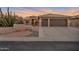 Single story home with desert landscaping and two car garage at 15973 W Sheila Ln, Goodyear, AZ 85395