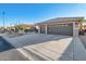 Two car garage with desert landscaping at 15973 W Sheila Ln, Goodyear, AZ 85395