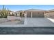 Single-story home with a two-car garage and desert landscaping at 15973 W Sheila Ln, Goodyear, AZ 85395