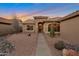 Inviting front entry with walkway and desert landscaping at 15973 W Sheila Ln, Goodyear, AZ 85395