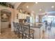 Kitchen with granite countertops, white cabinets, and a breakfast bar at 15973 W Sheila Ln, Goodyear, AZ 85395