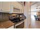 Kitchen with granite countertops and stainless steel appliances at 15973 W Sheila Ln, Goodyear, AZ 85395