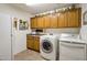 Laundry room with washer, dryer, and ample cabinetry at 15973 W Sheila Ln, Goodyear, AZ 85395