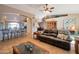 Living room with a view of the kitchen and breakfast bar at 15973 W Sheila Ln, Goodyear, AZ 85395