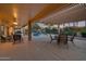 Covered patio with seating area overlooking the pool at 15973 W Sheila Ln, Goodyear, AZ 85395