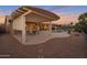 Covered patio with dining area adjacent to the pool at 15973 W Sheila Ln, Goodyear, AZ 85395