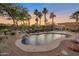 Relaxing kidney shaped pool with waterfall feature at 15973 W Sheila Ln, Goodyear, AZ 85395