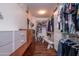 Large walk-in closet with ample shelving and drawers at 16442 W Quarry Ct, Surprise, AZ 85374