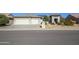 Single-story home with a two-car garage and desert landscaping at 16442 W Quarry Ct, Surprise, AZ 85374