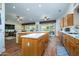 Open kitchen with island and hardwood floors at 16442 W Quarry Ct, Surprise, AZ 85374