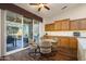 Kitchen nook with glass table and access to backyard at 16442 W Quarry Ct, Surprise, AZ 85374