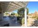 Covered patio with pergola and lush landscaping at 16442 W Quarry Ct, Surprise, AZ 85374