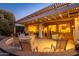 Evening view of a well-lit, covered patio at 16442 W Quarry Ct, Surprise, AZ 85374