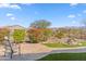 Landscaped backyard with fountain and pathway at 17674 E Fort Verde Rd, Rio Verde, AZ 85263