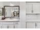 Modern bathroom with a large vanity, built-in shelving, and bright lighting at 17674 E Fort Verde Rd, Rio Verde, AZ 85263