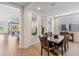 Open dining area with a dark wood table and access to the living room at 17674 E Fort Verde Rd, Rio Verde, AZ 85263