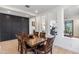 Modern dining room with dark wood table and built-in dark accent wall at 17674 E Fort Verde Rd, Rio Verde, AZ 85263